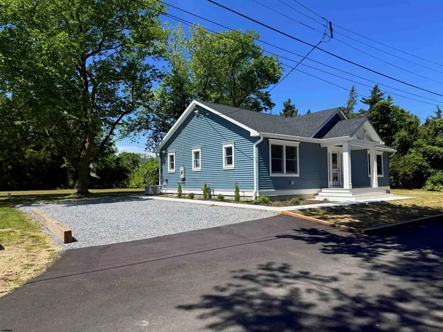 a front view of a house with yard