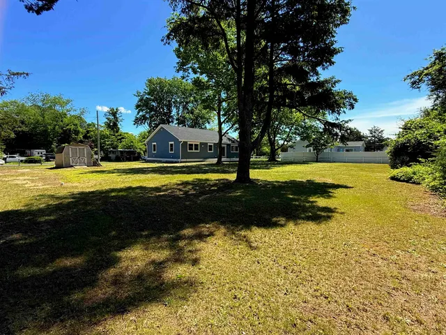 a view of a swimming pool with an outdoor space and seating area