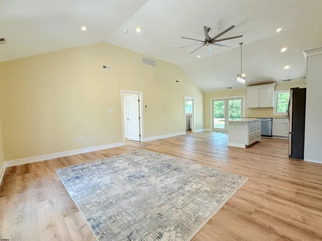a view of kitchen with cabinets and wooden floor