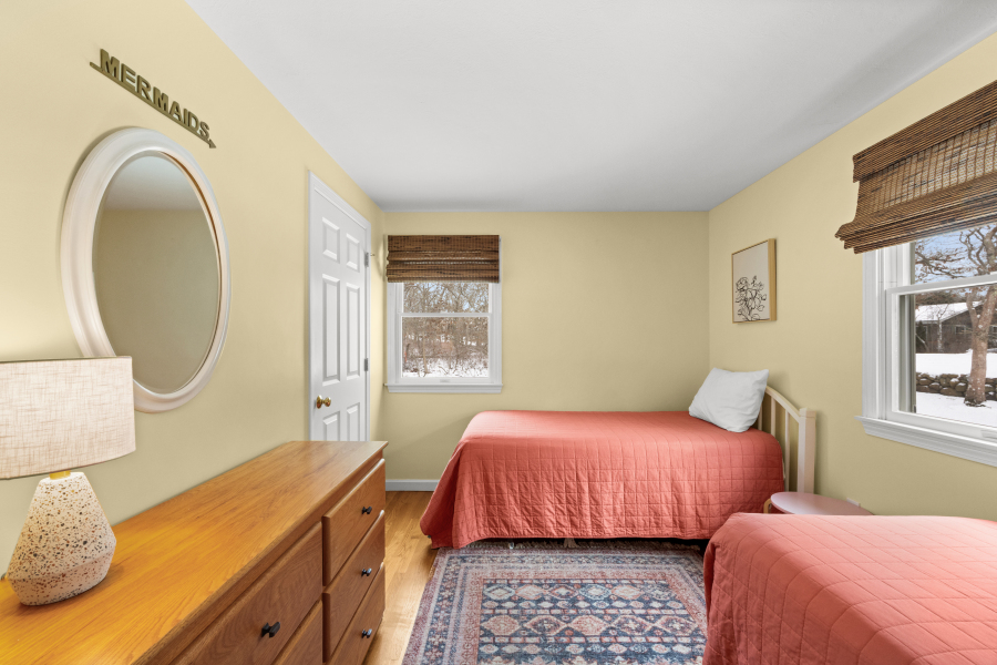 68 20th Street South Edgartown, MA 02539 - Photo 15 of 26 a bedroom with a bed a mirror and a window