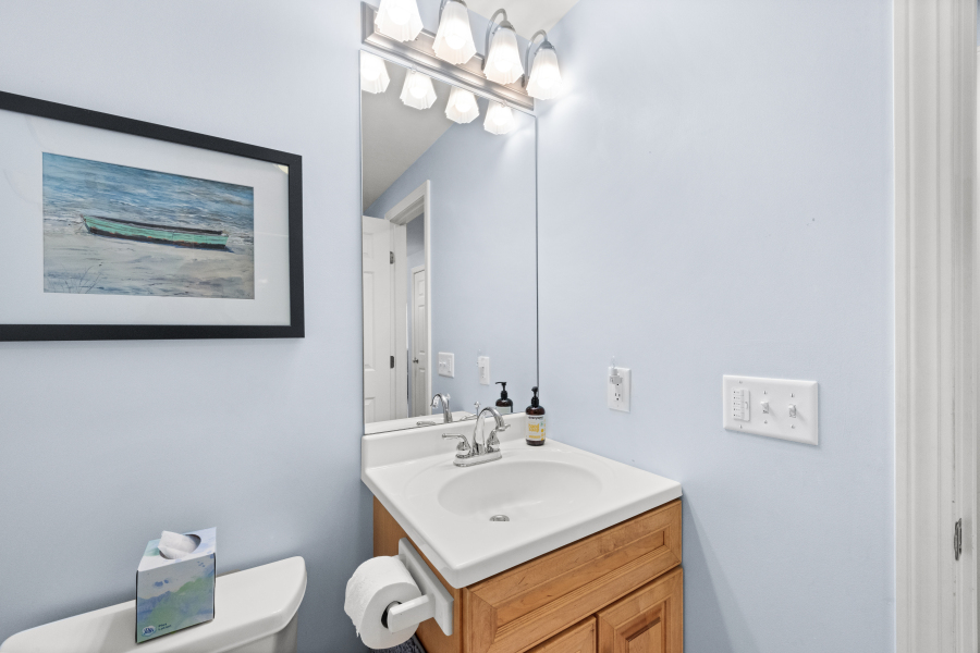 68 20th Street South Edgartown, MA 02539 - Photo 17 of 26 a bathroom with a sink a mirror and a toilet