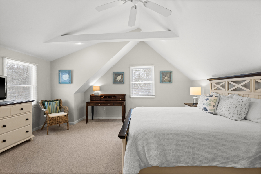 68 20th Street South Edgartown, MA 02539 - Photo 19 of 26 a bedroom with a bed and a dresser