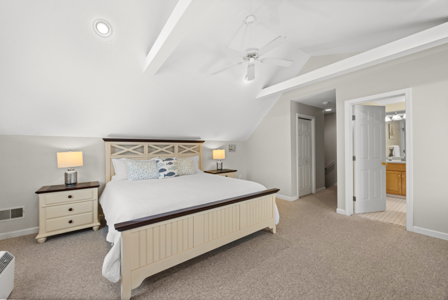 68 20th Street South Edgartown, MA 02539 - Photo 20 of 26 a bedroom with a bed and a night stand