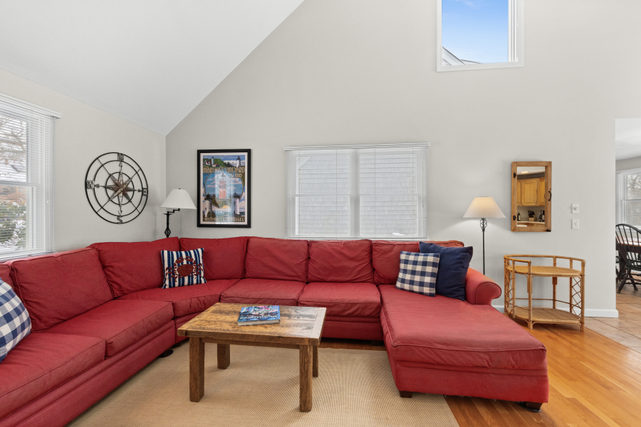 68 20th Street South Edgartown, MA 02539 - Photo 5 of 26 a living room with furniture a rug and a wall painting