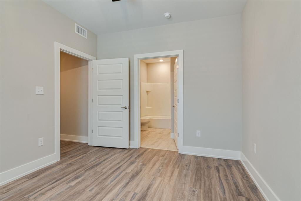 115 West Jones Street, Unit 201 Krum, TX 76249 - Photo 13 of 15 wooden floor in an empty room