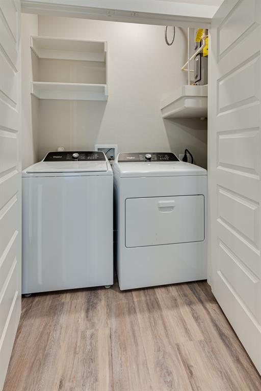 115 West Jones Street, Unit 201 Krum, TX 76249 - Photo 6 of 15 a utility room with closet dryer and washer