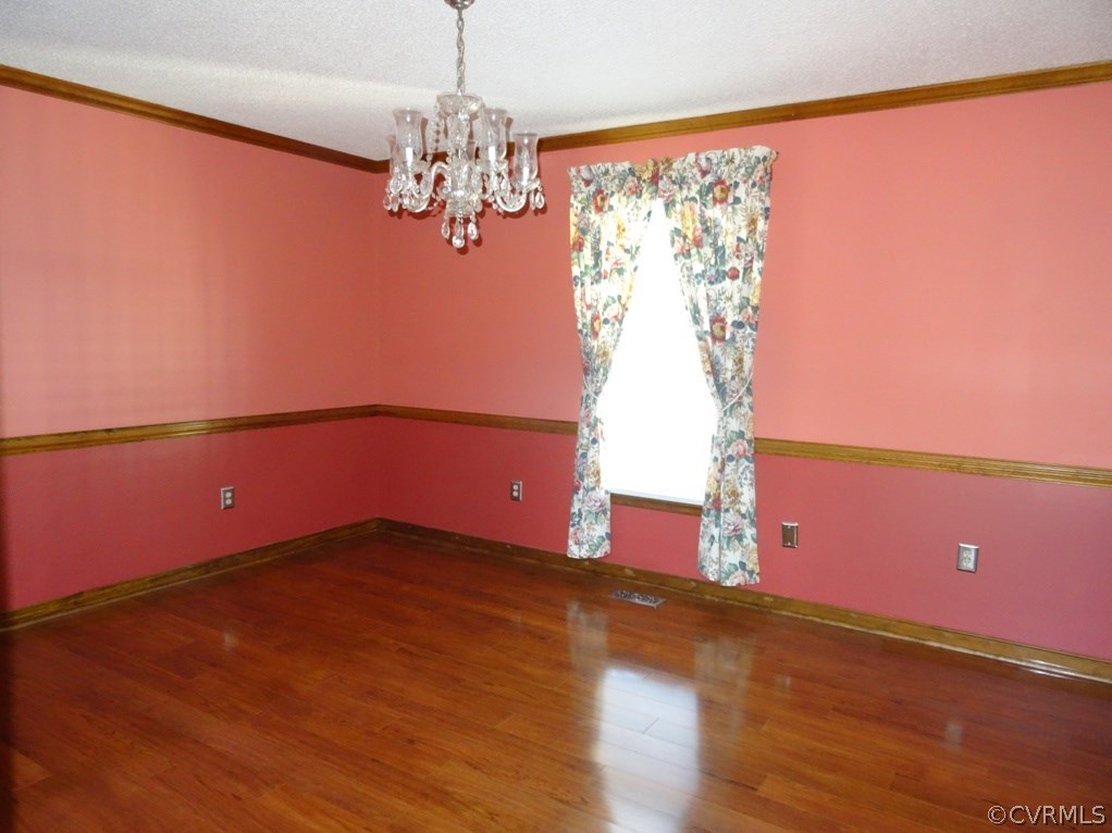 19225 Templeton Road Carson, VA 23830 - Photo 19 of 21 a view of a room with wooden floor and chandelier