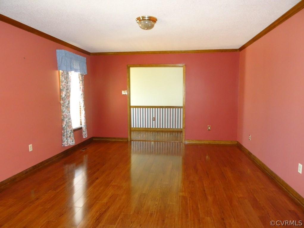 19225 Templeton Road Carson, VA 23830 - Photo 20 of 21 a view of an empty room with wooden floor and a window