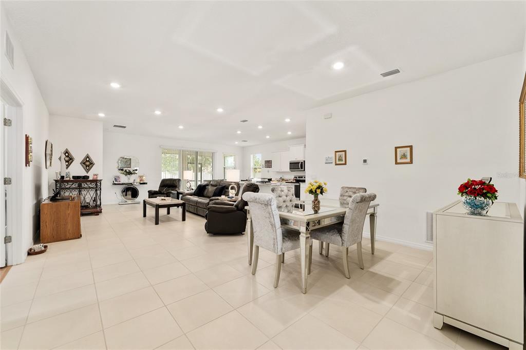 6175 Southwest 88th Loop Ocala, FL 34476 - Photo 11 of 56 a living room with furniture and a table