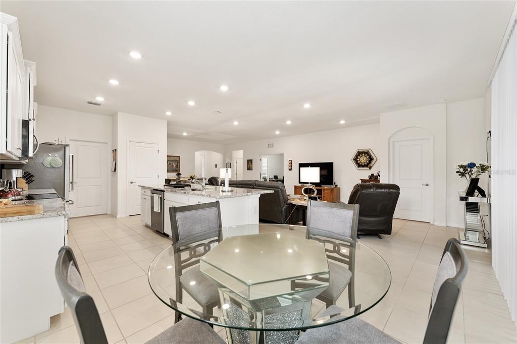 6175 Southwest 88th Loop Ocala, FL 34476 - Photo 24 of 56 a living room with stainless steel appliances furniture a dining table and kitchen view