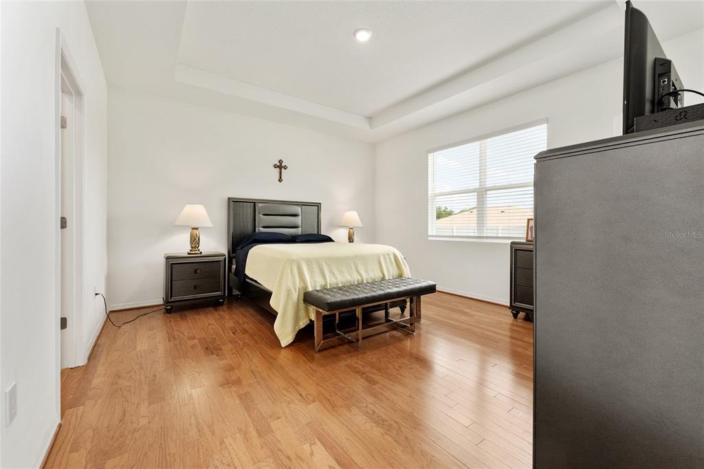 6175 Southwest 88th Loop Ocala, FL 34476 - Photo 25 of 56 a bedroom with a bed table and a window