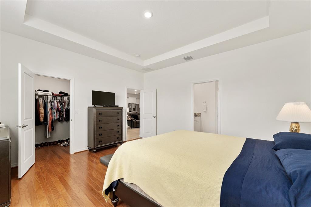 6175 Southwest 88th Loop Ocala, FL 34476 - Photo 27 of 56 a bedroom with a bed and a television