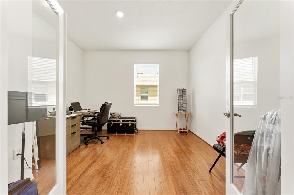 6175 Southwest 88th Loop Ocala, FL 34476 - Photo 37 of 56 a living room with furniture a air conditioner vent and a window