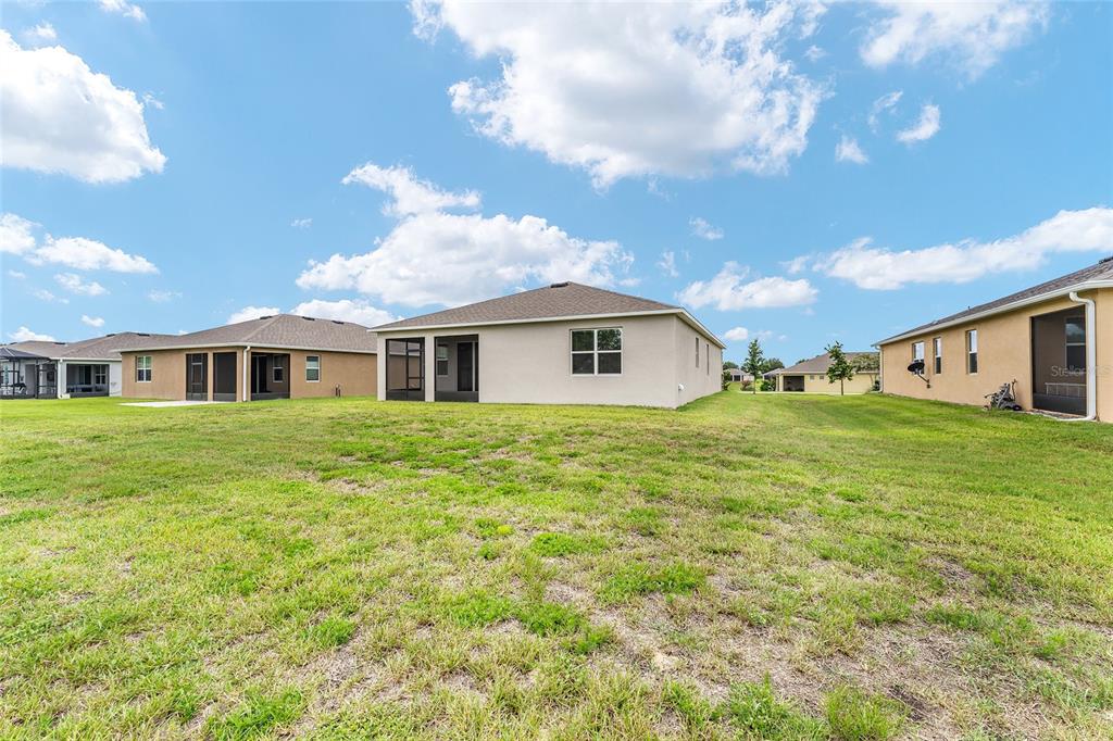 6175 Southwest 88th Loop Ocala, FL 34476 - Photo 49 of 56 a front view of house with yard and trees around