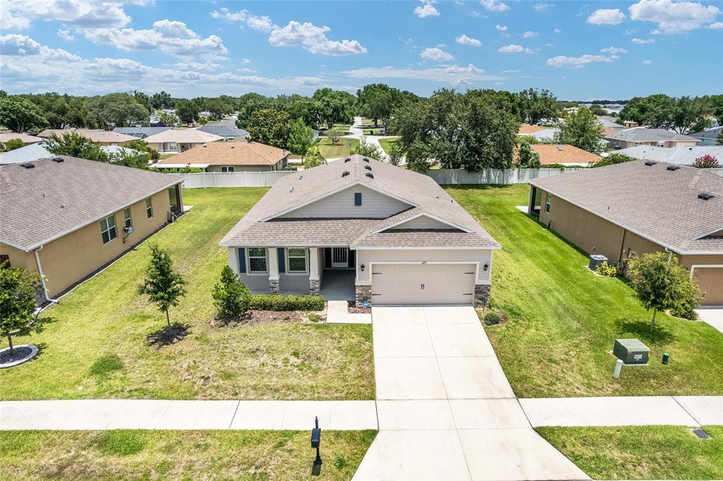 6175 Southwest 88th Loop Ocala, FL 34476 - Photo 51 of 56 a aerial view of a house with a yard