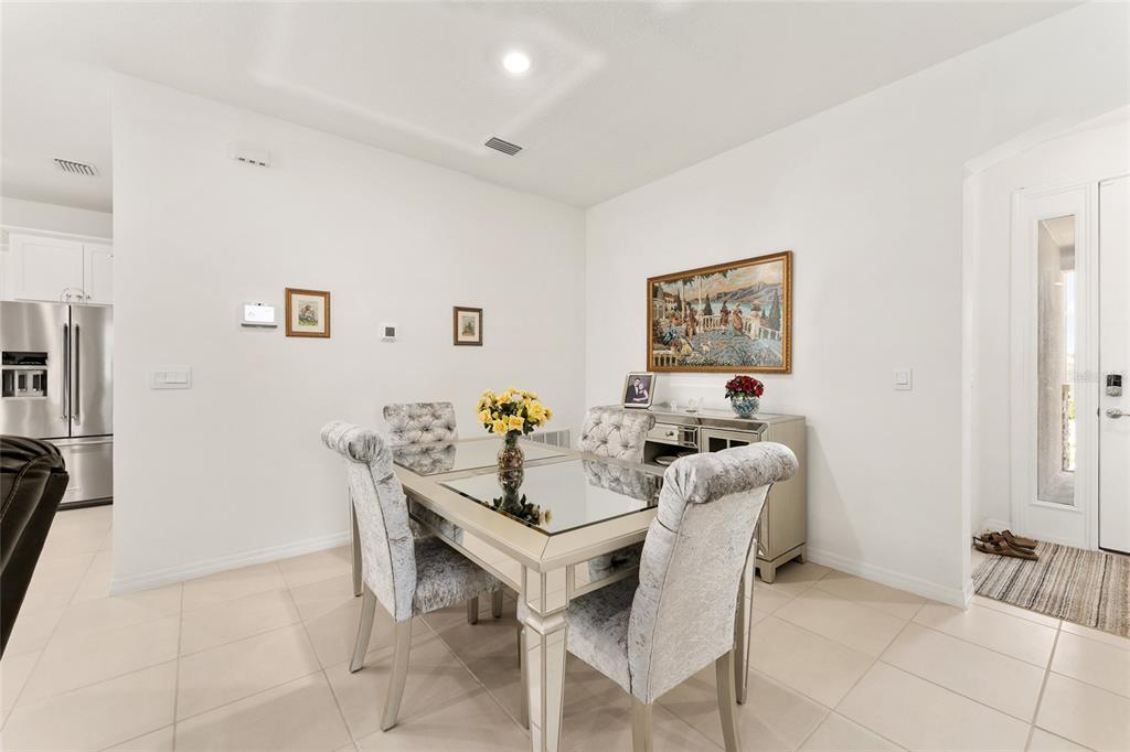 6175 Southwest 88th Loop Ocala, FL 34476 - Photo 8 of 56 a view of a dining room with furniture and a window