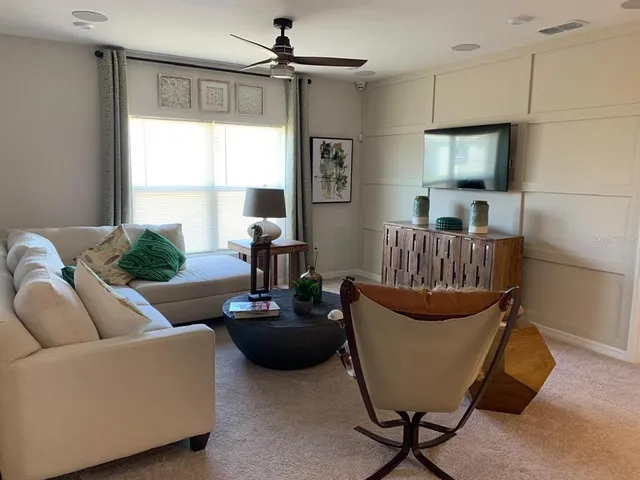 a living room with furniture and a window