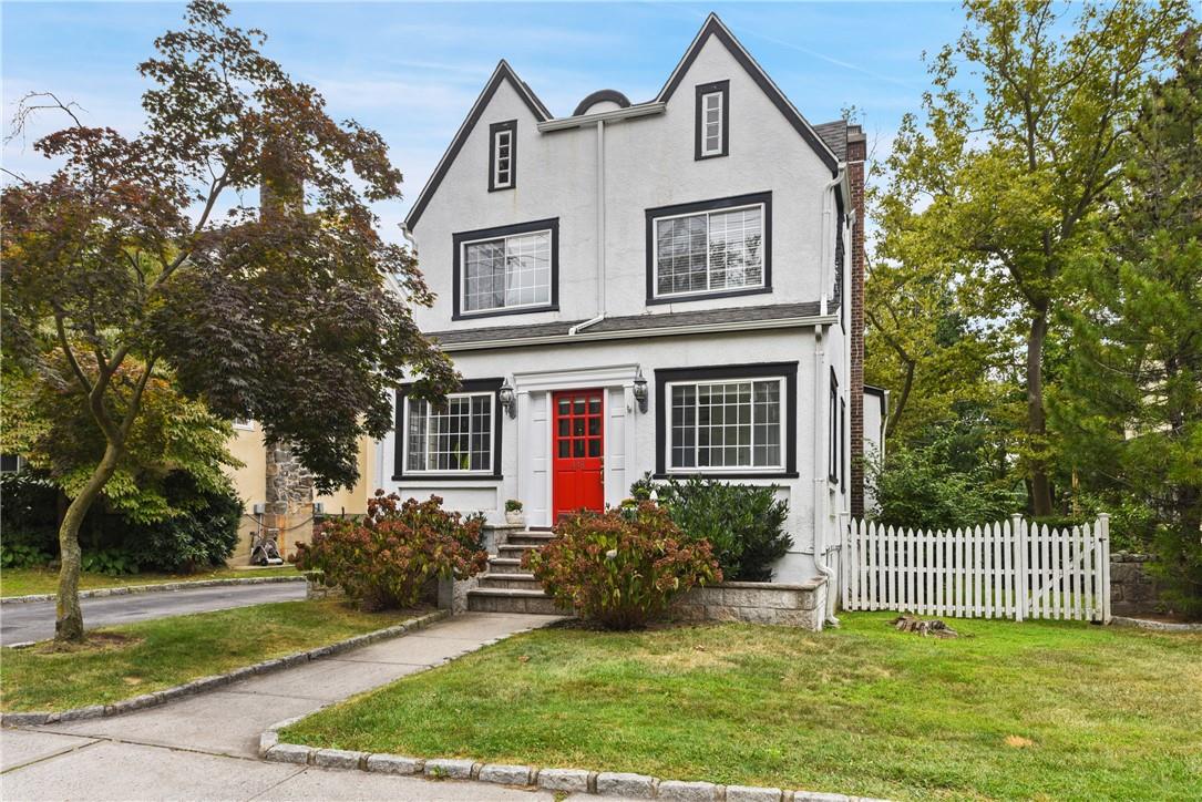 448 Milton Road Rye, NY 10580 - Photo 1 of 1 a view of a house with a yard plants and a large tree