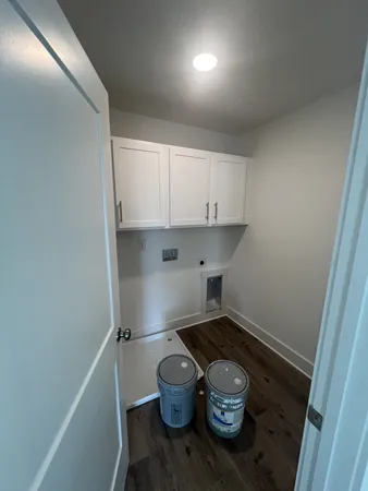 a kitchen with a wooden floor and a sink