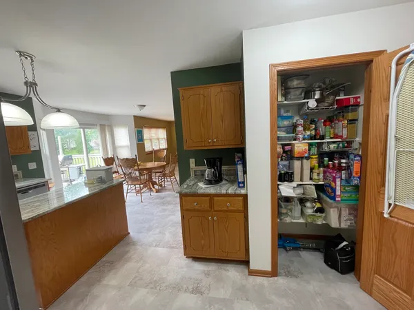 a living room with furniture and a cabinet