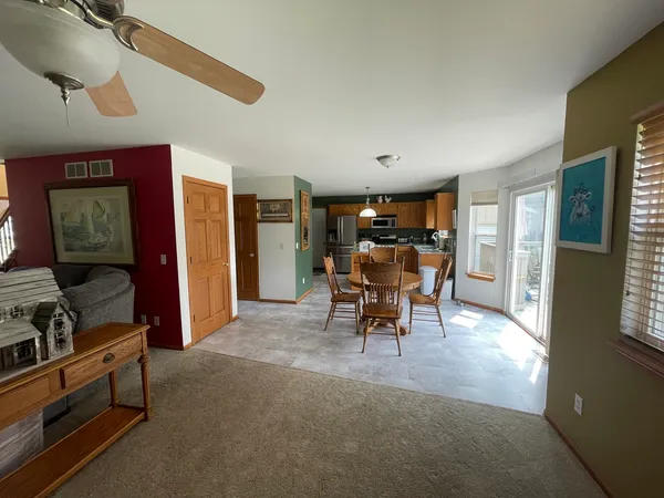 a view of a livingroom with furniture and a window