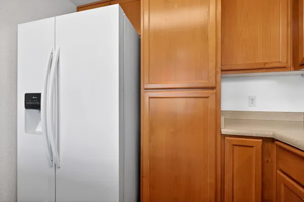 a kitchen with stainless steel appliances granite countertop a sink stove and microwave