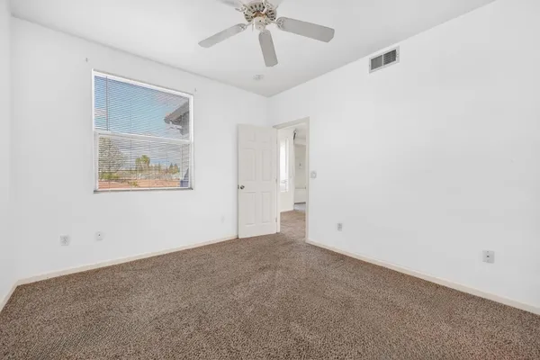 a bathroom with a granite countertop sink toilet mirror and shower