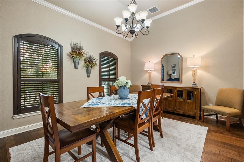 3715 Lonesome Creek Road Granbury, TX 76049 - Photo 13 of 40 a view of a dining room with furniture and chandelier