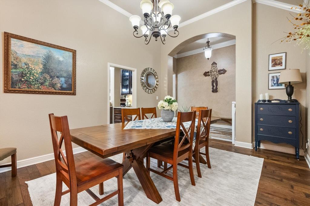 3715 Lonesome Creek Road Granbury, TX 76049 - Photo 14 of 40 a view of a dining room with furniture and wooden floor