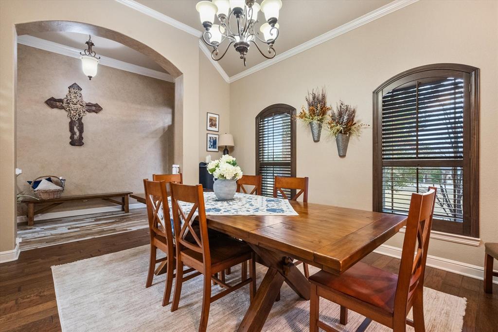 3715 Lonesome Creek Road Granbury, TX 76049 - Photo 15 of 40 a view of a dining room with furniture window and wooden floor