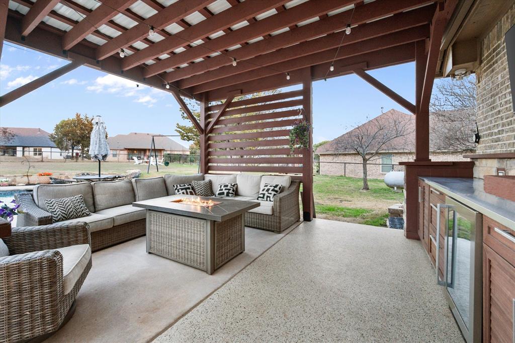 3715 Lonesome Creek Road Granbury, TX 76049 - Photo 2 of 40 a view of a porch with couches and city view