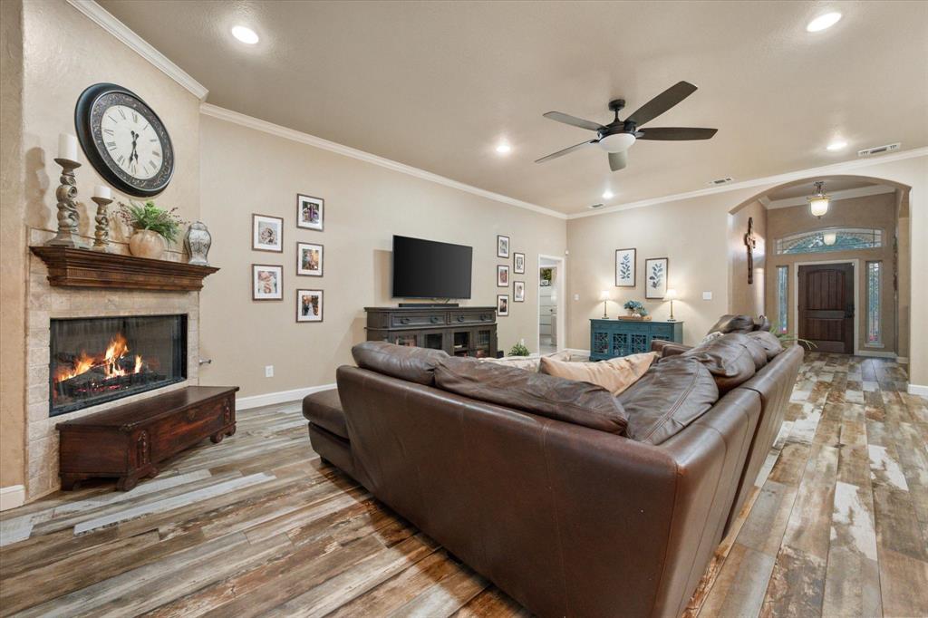 3715 Lonesome Creek Road Granbury, TX 76049 - Photo 22 of 40 a living room with furniture and a fireplace
