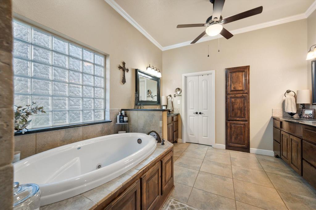 3715 Lonesome Creek Road Granbury, TX 76049 - Photo 25 of 40 a bathroom with a bathtub and a shower