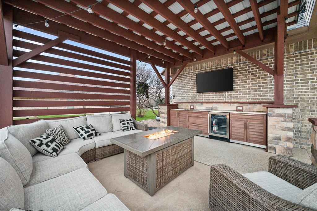 3715 Lonesome Creek Road Granbury, TX 76049 - Photo 3 of 40 a living room with furniture and a flat screen tv
