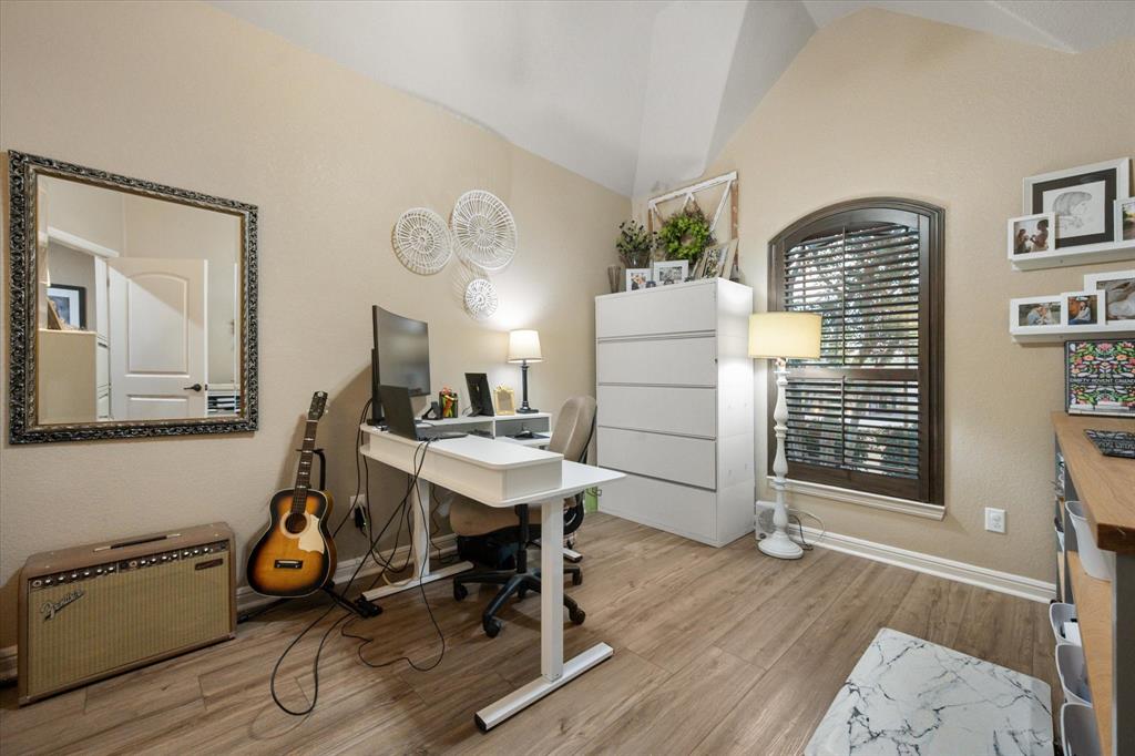 3715 Lonesome Creek Road Granbury, TX 76049 - Photo 34 of 40 a view of a workspace with furniture and a window