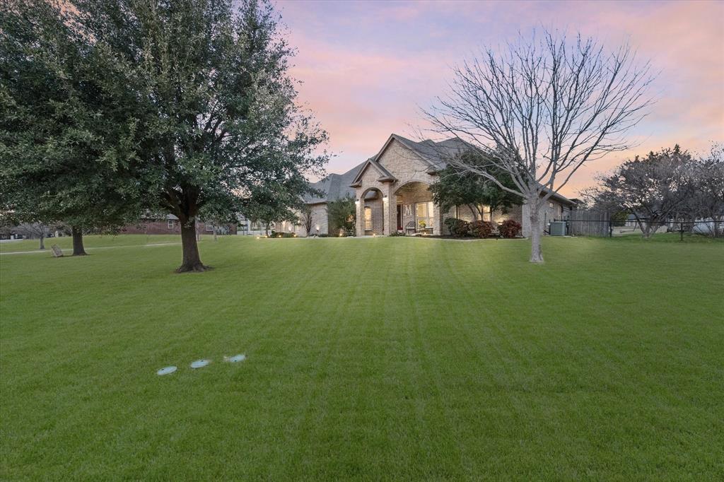 3715 Lonesome Creek Road Granbury, TX 76049 - Photo 5 of 40 a view of large yard with a house in the background