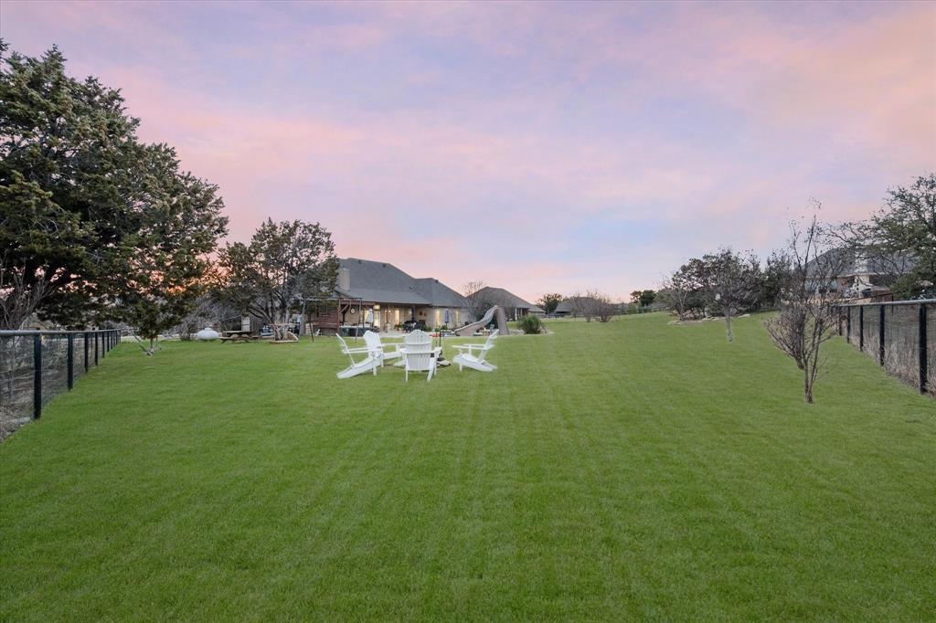 3715 Lonesome Creek Road Granbury, TX 76049 - Photo 7 of 40 a view of a lake with houses in back
