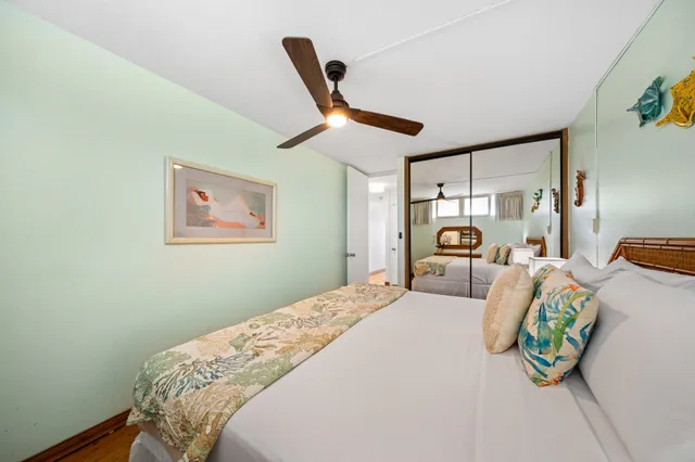 a bedroom with bed and a window