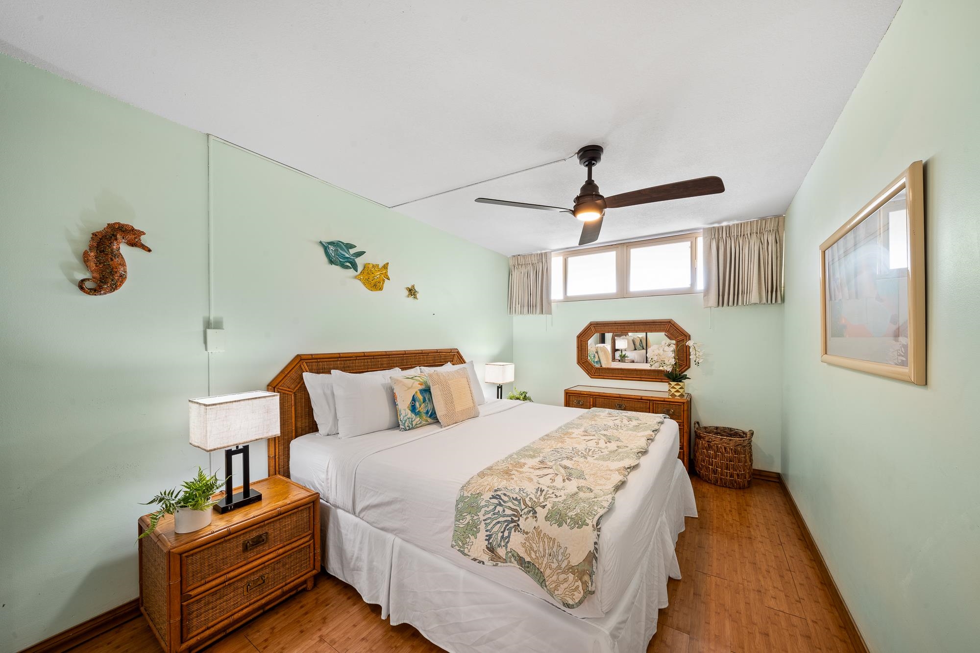 4471 Lower Honoapiilani Road, Unit 203 Lahaina, HI 96761 - Photo 19 of 40 a bedroom with a bed and window