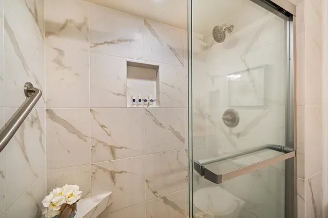 a bathroom with a sink a toilet and mirror