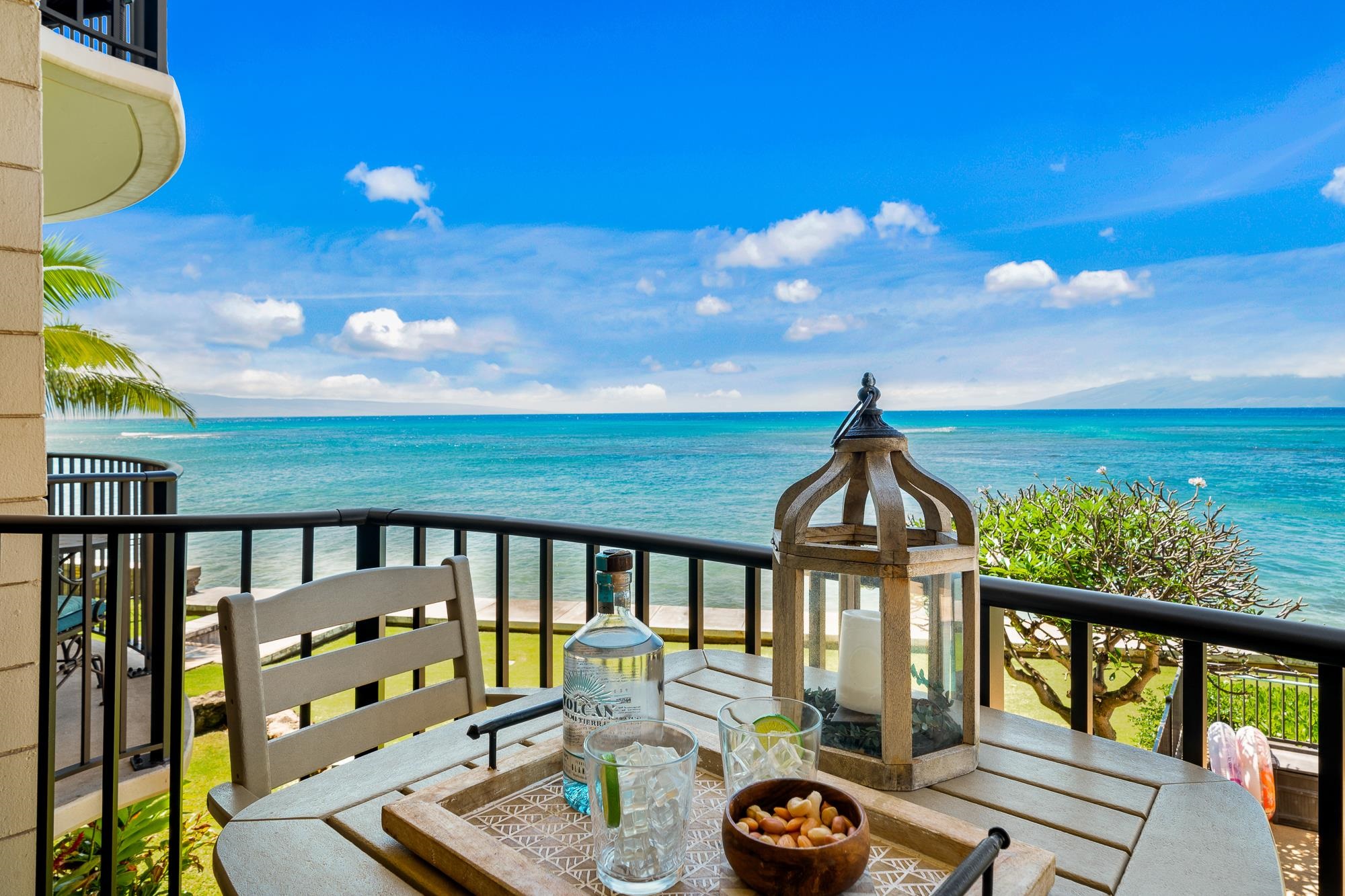 4471 Lower Honoapiilani Road, Unit 203 Lahaina, HI 96761 - Photo 2 of 40 a view of a balcony with chairs