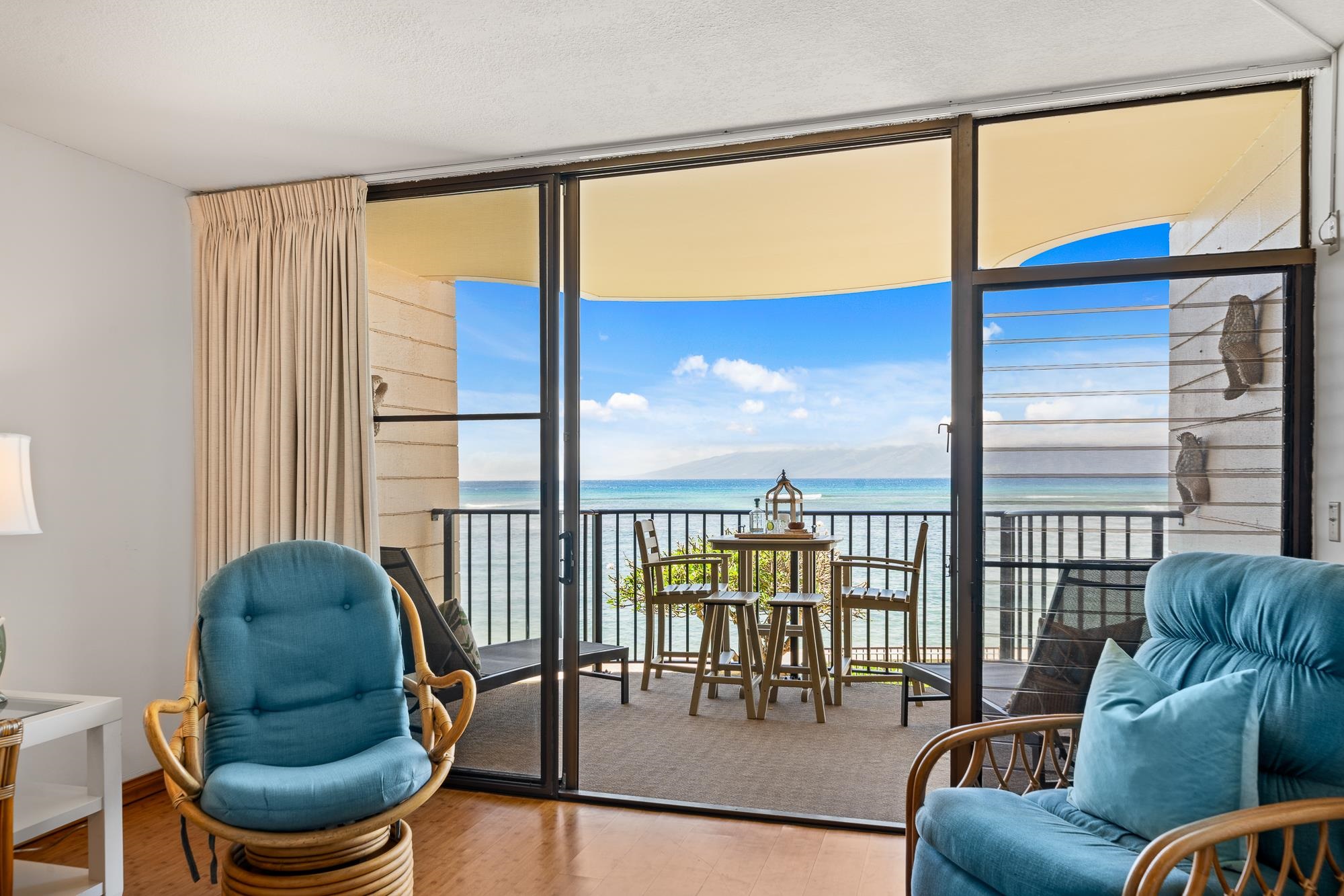 4471 Lower Honoapiilani Road, Unit 203 Lahaina, HI 96761 - Photo 32 of 40 a living room with furniture and a window