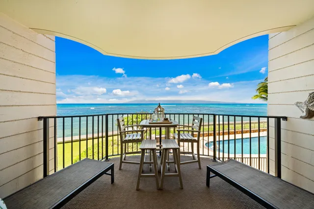 a view of a balcony with ocean view