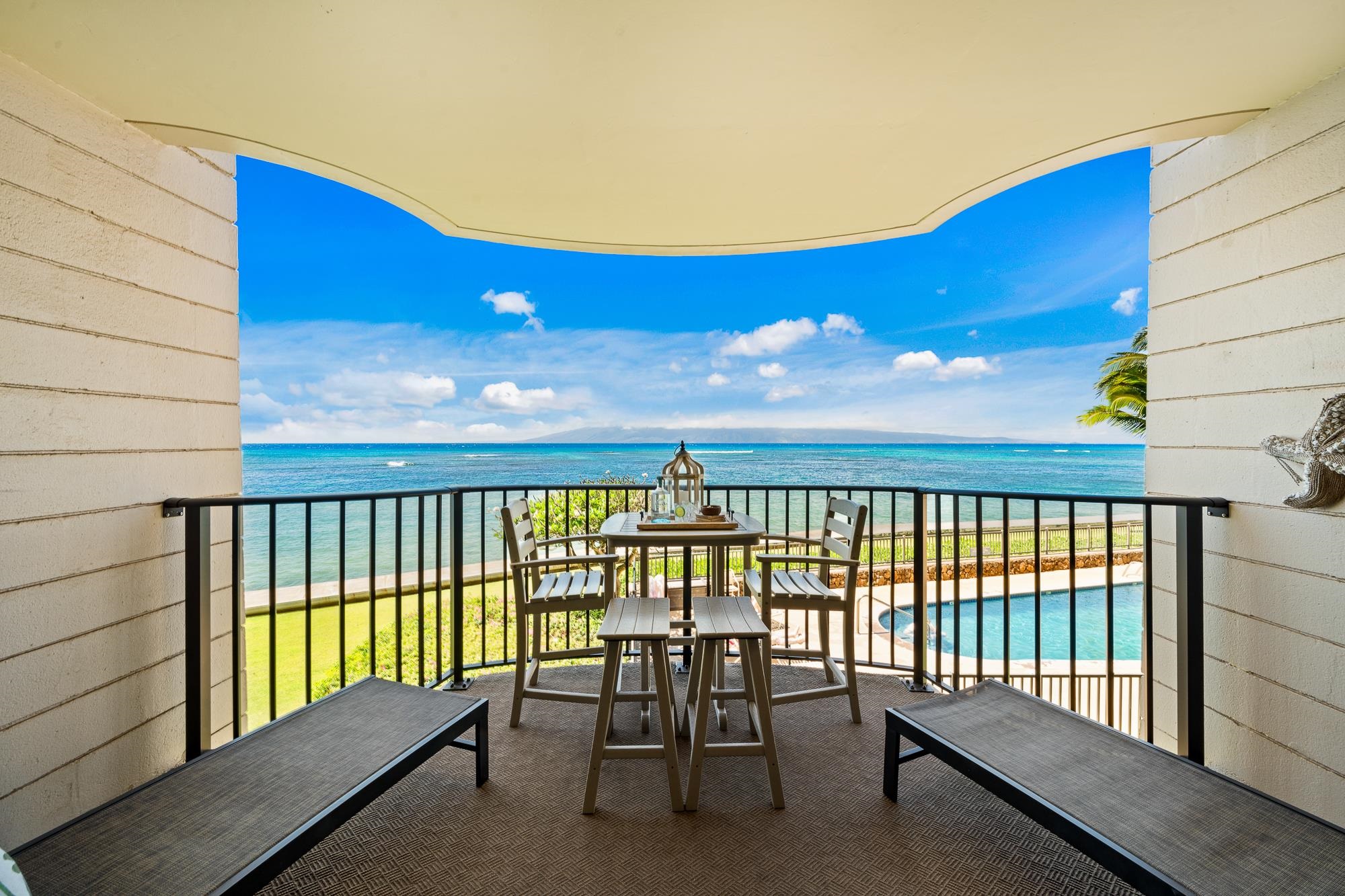 4471 Lower Honoapiilani Road, Unit 203 Lahaina, HI 96761 - Photo 34 of 40 a view of a balcony with furniture
