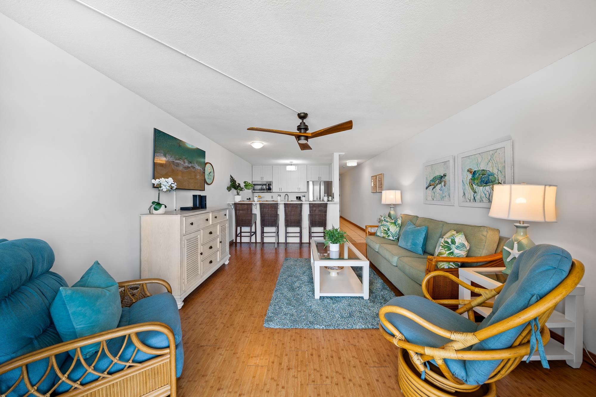 4471 Lower Honoapiilani Road, Unit 203 Lahaina, HI 96761 - Photo 7 of 40 a living room with furniture and a flat screen tv