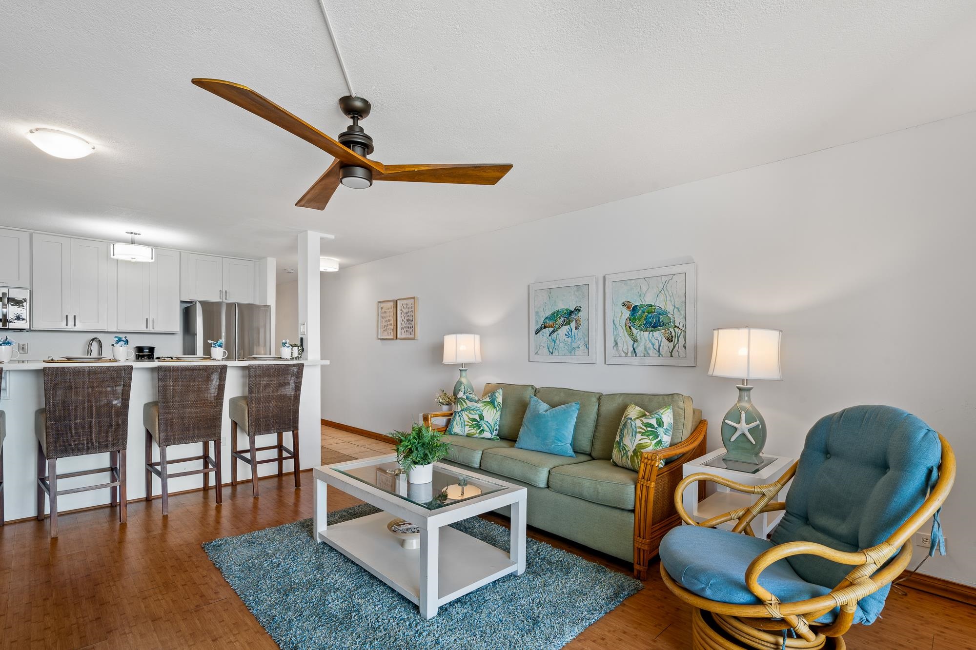 4471 Lower Honoapiilani Road, Unit 203 Lahaina, HI 96761 - Photo 10 of 40 a living room with furniture and wooden floor