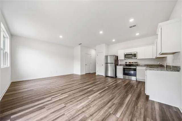a view of kitchen with wooden floor