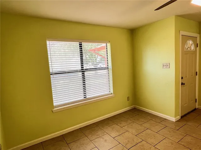 a view of a room that has a window in it