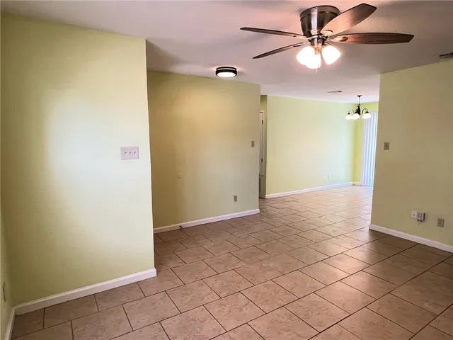 a view of a backyard with wooden fence