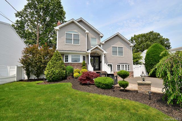 70 Westgate Road Massapequa Park, NY 11762 - Photo 1 of 1 a front view of house with yard and green space
